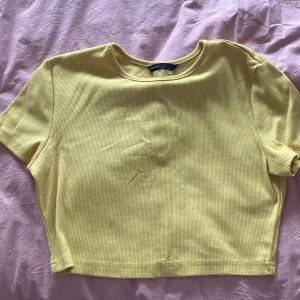 gul t shirt crop top  - yellow gul crop top baby t shirt. brighter than picture polyester 75%, cotton 25%