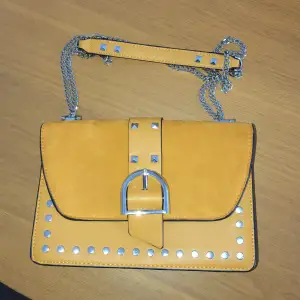 Faux leather and velvet medoum size bag. Can be used as crossbody or shoulder, never used. Bought in London