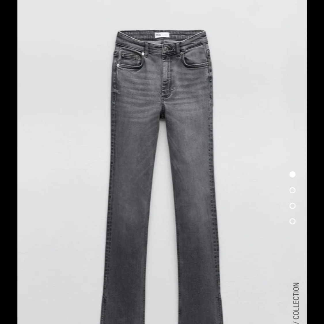 Gråa jeans med slit