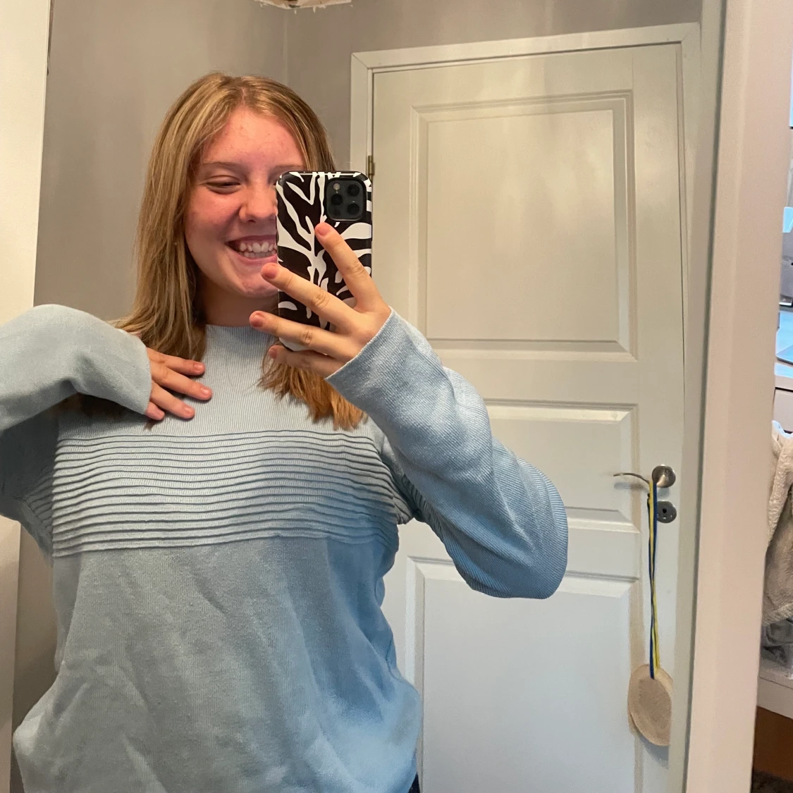 Ljusblå tröja  - 91