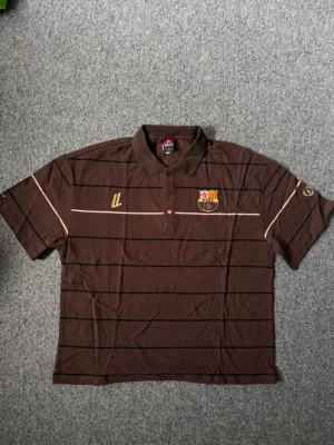Barcelona brown polo shirt - Size M, true to size. Unused, brand new and fresh. Please feel free to ask questions.