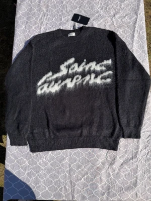 YSL black knit sweater - Size M, true to size. As new. Very comfortable and never worn