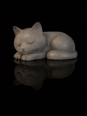 Dekorativ sovande katt i betong - Söt liten prydnad i form av en sovande katt, gjord i grå betong. Perfekt som dekoration på hyllan, skrivbordet eller i fönstret. Katten har mjuka former och ett lugnt uttryck med slutna ögon.