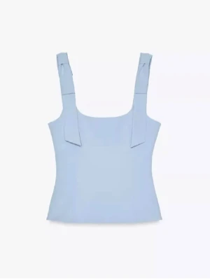 Blå topp med rosetter från Zara  - Jättefin blå topp från Zara, använd 1 gång🩵