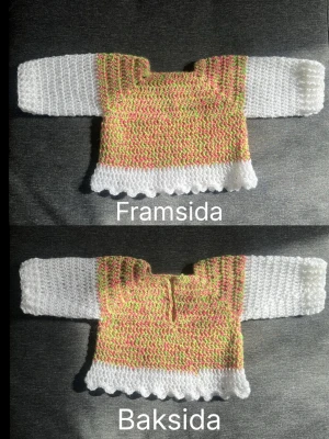 Handgjord virkad babytröja pastell - Söt handgjord virkad babytröja i pastellfärger med vitt, rosa och grönt garn. Tröjan har långa vita ärmar och vågig kant nertill. Perfekt för dig som gillar unika plagg med färgglad touch. Det vita garnet är 100% Akryl, det färgglada garnet är en blandning på 60%Ull, 20%Nylon och 20%Akryl