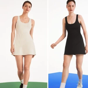 Oysho sportklänning - Fin creme vit sportklänning men inbyggd shorts med ficka för mobilen i strl M, använd en gång