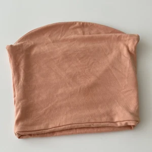 Tubtopp - En korallfärgad tubtopp från bibok. Jag har aldrig använt den då toppen blev för liten för mig.