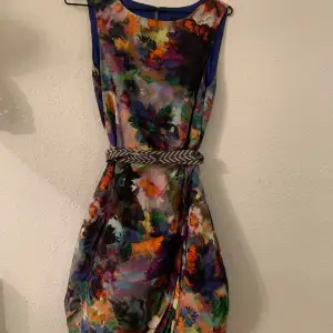 Silk dress, party/cocktail, beautiful colours. Tulle undergarment, fully lined. Draped at waist. Excellent condition, worn once. As new. 
