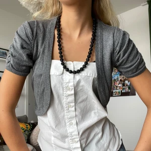 Bolero - glittrig bolero från Hm!