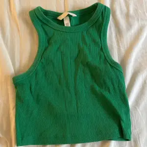 Grönt linne i storlek xxs