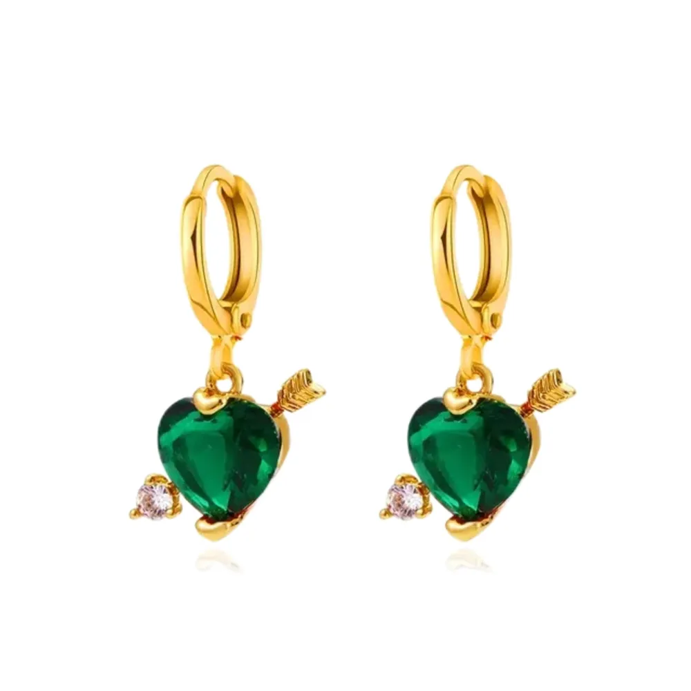 Material: Stainless Steel. Cupid Love Earrings – These enchanting, gold-plated, stainless steel earrings showcase a pair of delicately crafted cupid wings, providing a lightweight and comfortable adornment for any occasion. . Accessoarer.
