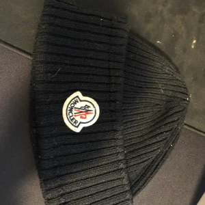 Moncler beenie - Selling because its not being used!   I have the receipt!