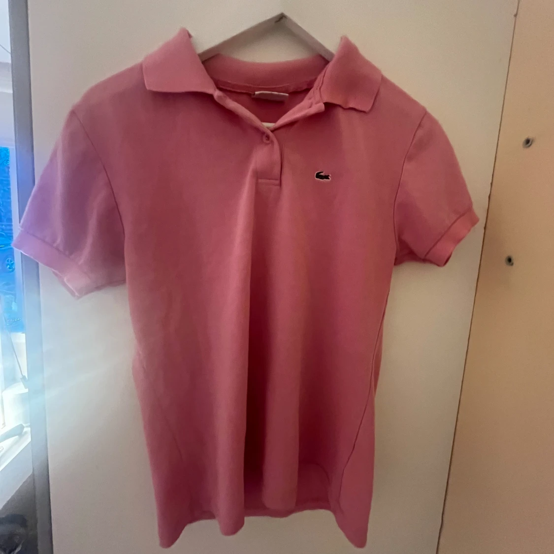 Rosa piké från Lacoste