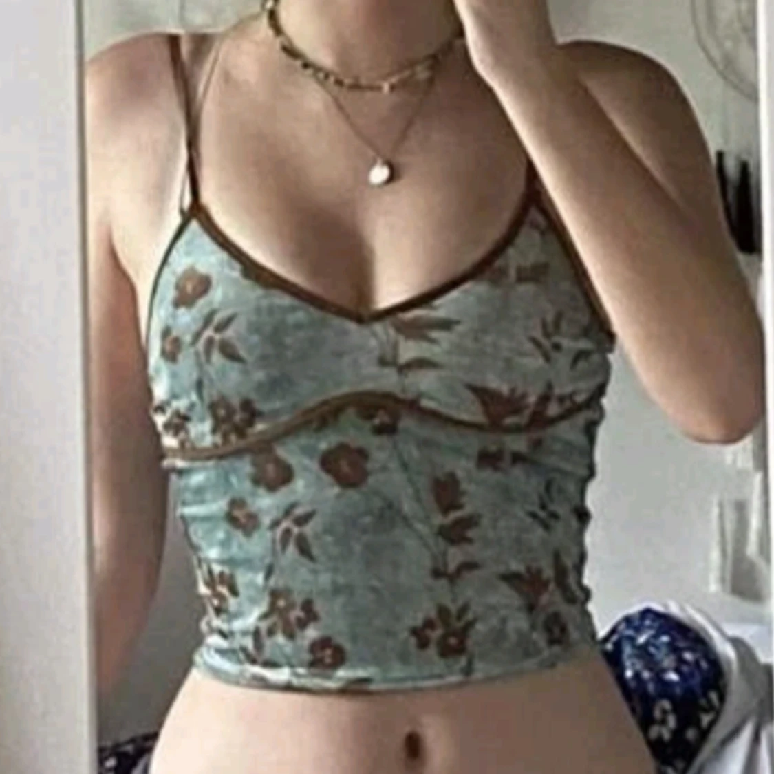 Blommigt turkost linne