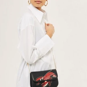 Svart hummer-väska med guldkedja från Topshop - Oanvänd