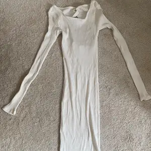 White midi dress with open back from NAKD. 
