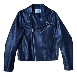Classic biker jacket from Acne Studios, comes in a slimmer, cropped fit. Very Hedi Slimane-like in terms of vibes. Has been gently used and well taken care of, no flaws. This version is with black leather and black suede details. Fits TTS.