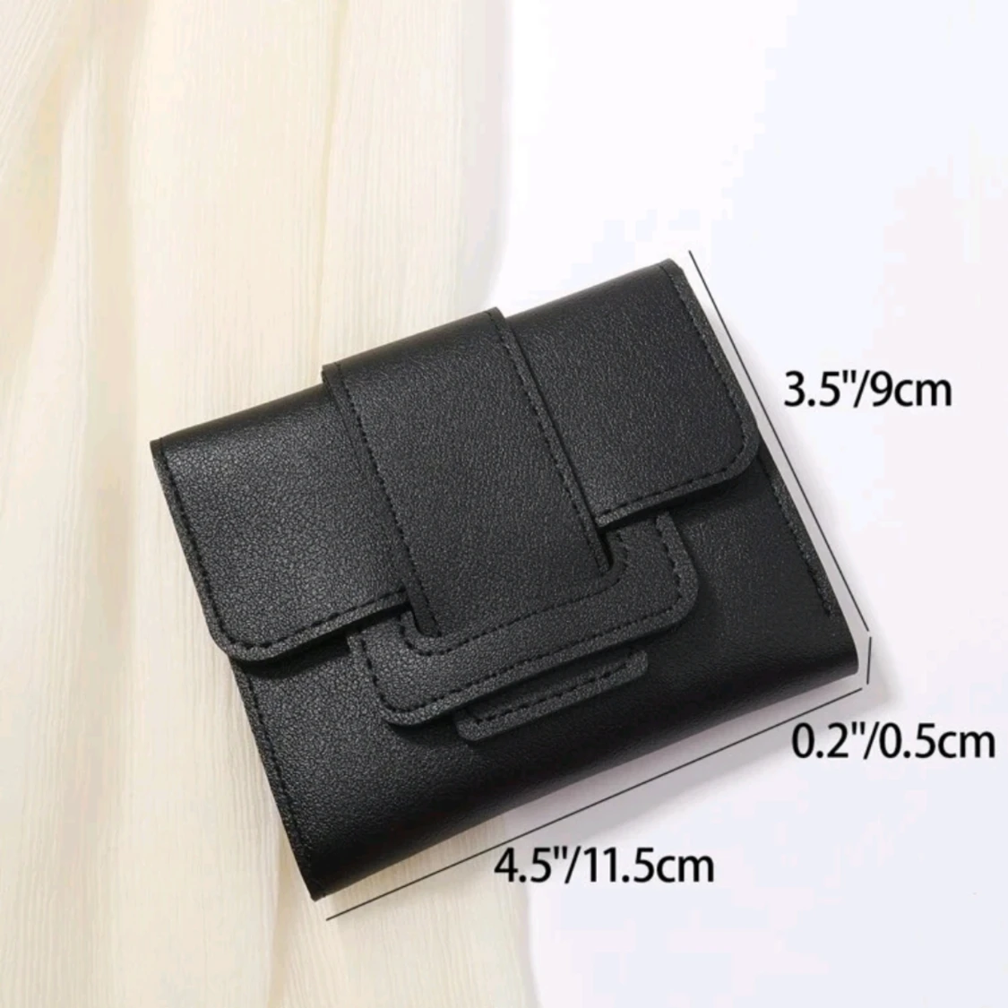 En svart plånbok  - 91