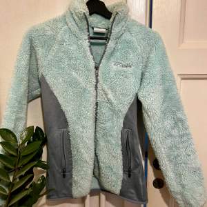 Size XS Color icy light mint blue 2 zip pockets, full zip plush, soft, stretch side panels for extra comfort. polyester/elastane machine wash cold
