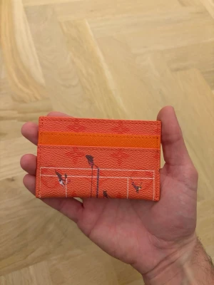 Orange plånbok  - Plånbok med tennis motiv på