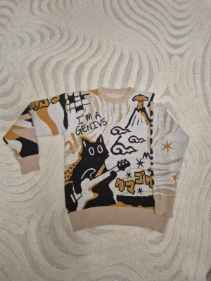 Beige och svart stickad tröja med kattmotiv - Winter Genivs cat sweater 