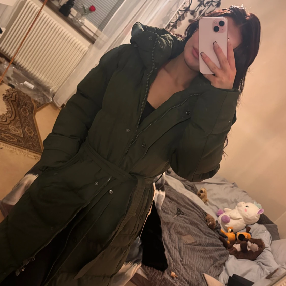 Mörkgrön lång pufferjacka