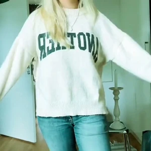 Stickad tröja med tryck - Cool tröja med tryck ”Another”. Har zlits på båda sidor som jag sytt ihop 