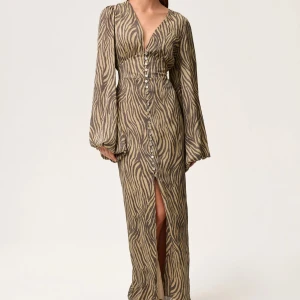 Adoore klänning  - Zebramönstrad klänning från Adoore i storlek 32, Är för liten för mig så måste tyvärr säljas. Alla knappar finns kvar.