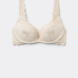 Intimissimi bh gioia - Säljer en intimissimi bh med vacker spets och blommigt mönster. Bh-n har en djup v-ringning och breda axelband i spets. Materialet är mjukt och bekvämt, knappt använd så den är som ny. 