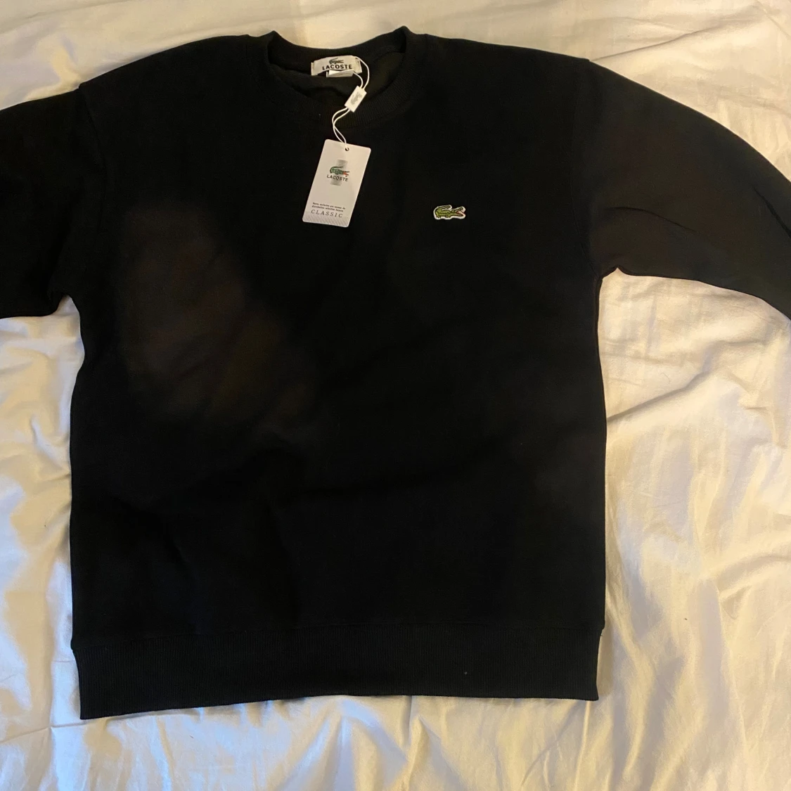 Svart sweatshirt från Lacoste