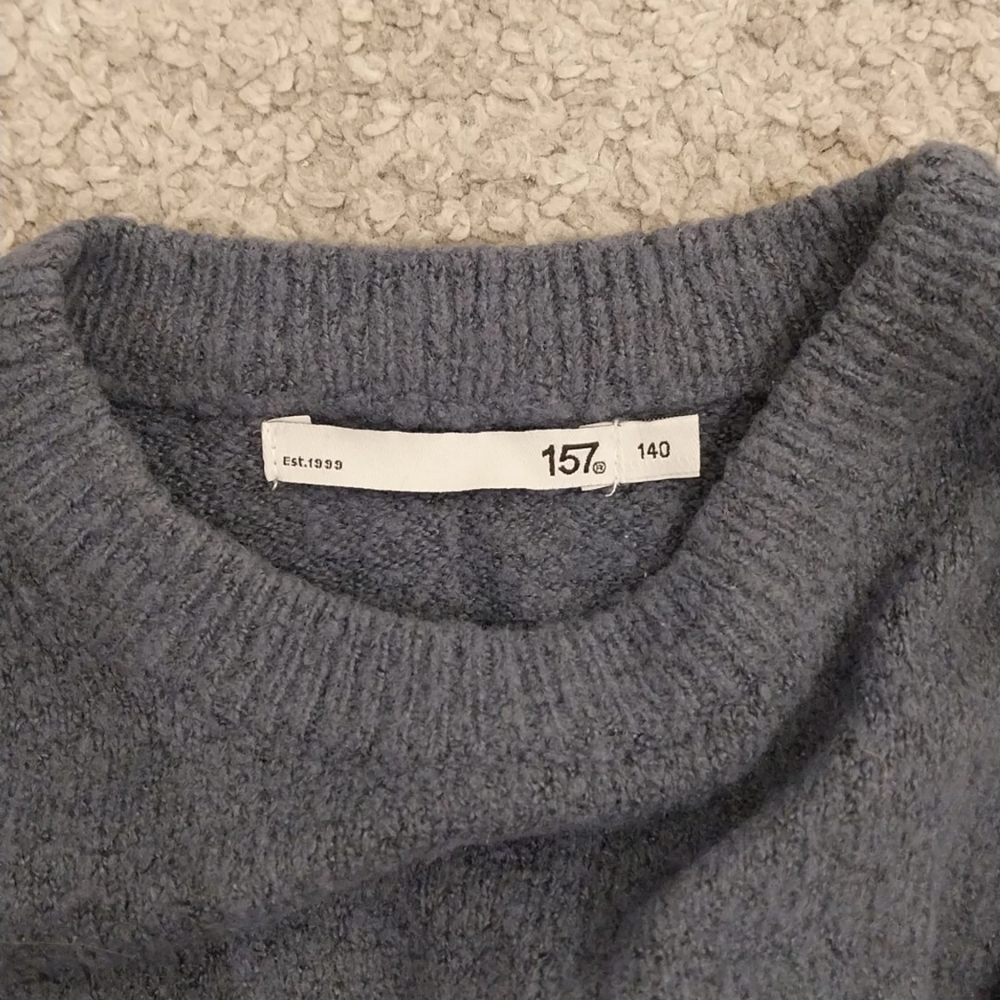 Blå stickad tröja från 157 - 2
