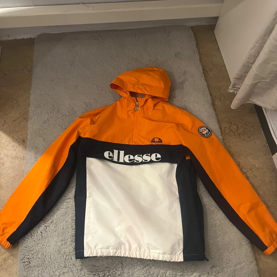 Ellesse orange och vit vindjacka