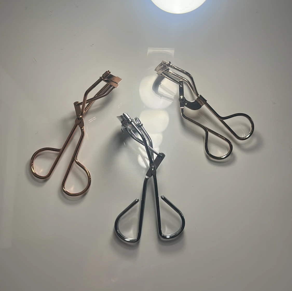 Tre ögonfransböjare