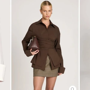 Brun skjorta med siluett  - Brun skjorta med omlott detalj. Passar en m/40 person