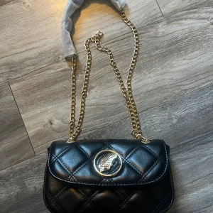 Ioaku - Limiterade ioaku väskan som tillhör julkalendern i guld