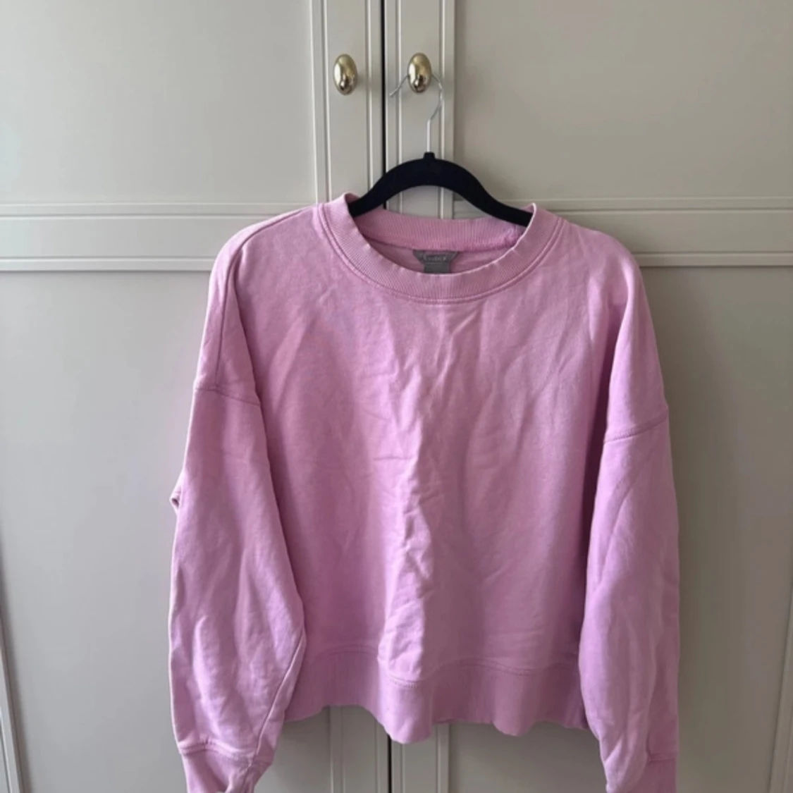 Ljusrosa sweatshirt med loose fit