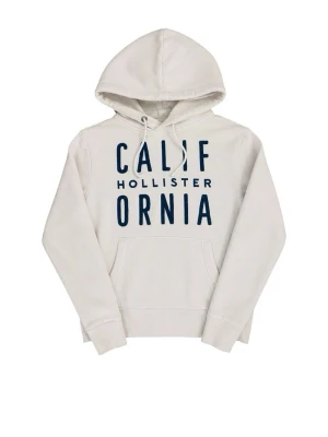 Vit hoodie från Hollister med tryck - Säljer en vit hoodie från Hollister med stor mörkblå text 'CALIFORNIA' och mindre Hollister-logga på bröstet. Hoodien har huva med dragsko och en klassisk magficka. Perfekt för en avslappnad och trendig stil.
