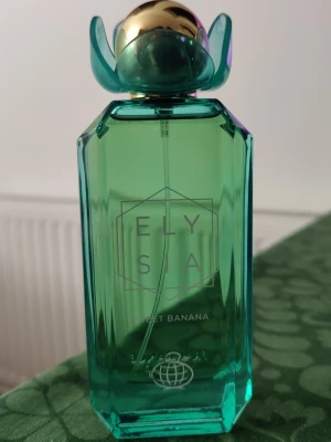 Fragrance World Elysia Sweet Banana  - Fragrance World Elysia Sweet Banana ca 97-98ml kvar av 100. Skickar gärna med ett litet parfymprov vid köp 