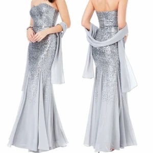 Balklänning/festklänning - Säljer min silvriga paljettklänning från goddiva, köpte den ifrån pinkboutique storlek xs/s. Sjalen man har runt armarna följer även med. Klänningen är endast använd 1 gång under några få timmar så den är i princip helt ny. Fler bilder kan skickas vid efterfrågan mvh