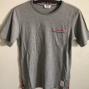 Women’s Thom Browne Classic Pocket T-Shirt  Size small, regular small fit.  Excellent condition, no flaws or damage.  DM if you need exact size measurements.   Buyer pays for all shipping costs. All items sent with tracking number.   No swaps, no trades, no offers. 