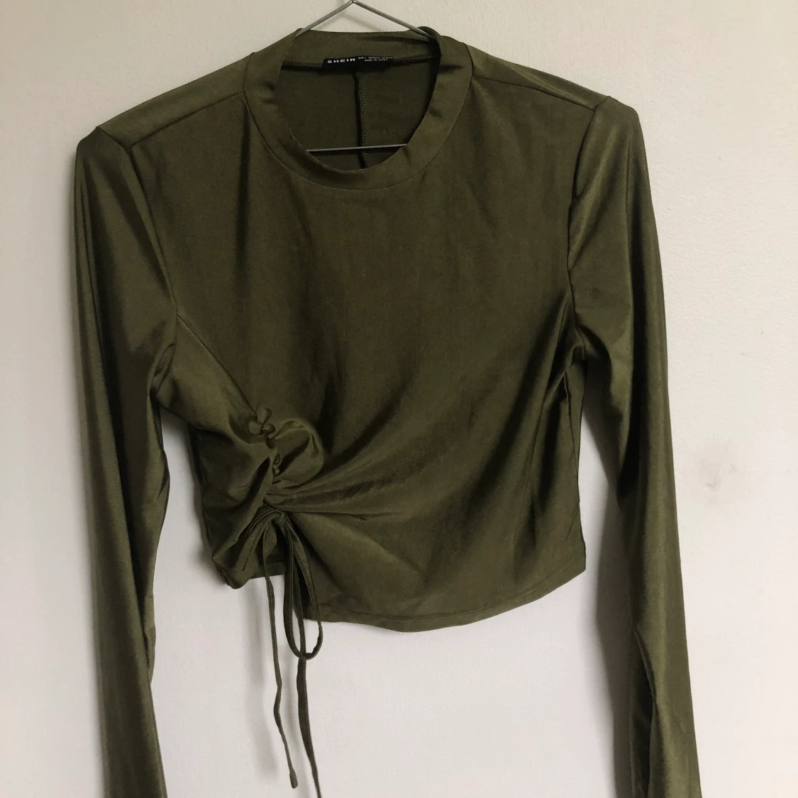 Mörkgrön top i stretchmaterial - 90