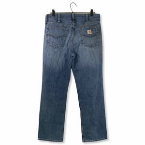 Vintage Carhartt Jeans - Vintage Carhartt Jeans. Storlek: 34x32. Litet hål på högerbenet.