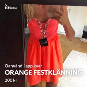 Orange festklänning i storlek XS, oanvänd med prislapp kvar 