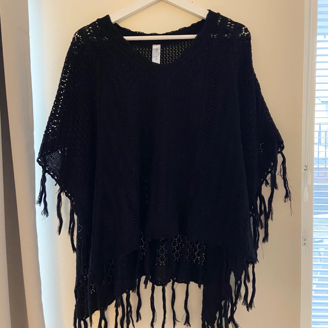 Svart poncho