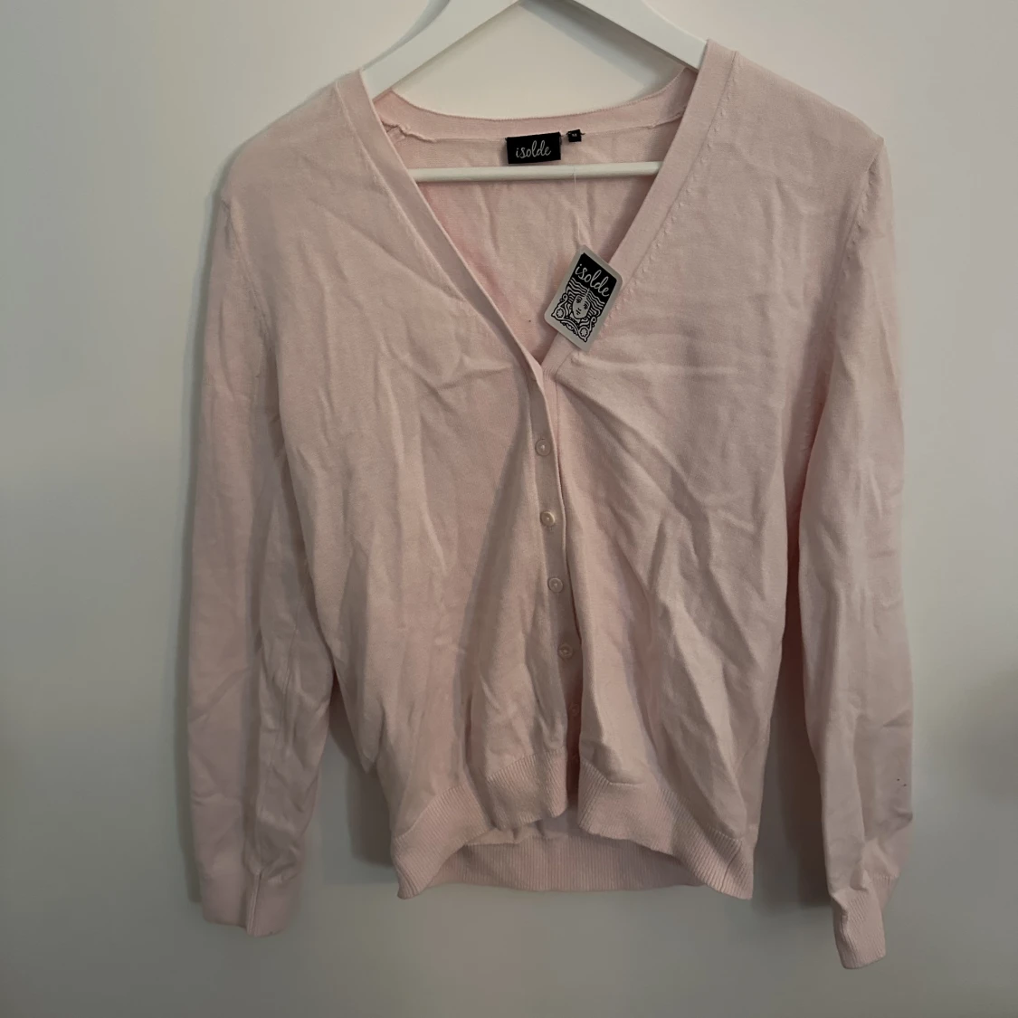 Rosa kofta med knappar