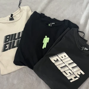 Billie Eilish - Säljer dessa tre Billie Eilish tröjor tillsammans då de inte används längre. Den beige och svarta med neon text är i storlek: S medans den svarta med beige text är i storlek: M Säljer alla tre tillsammans för 50kr