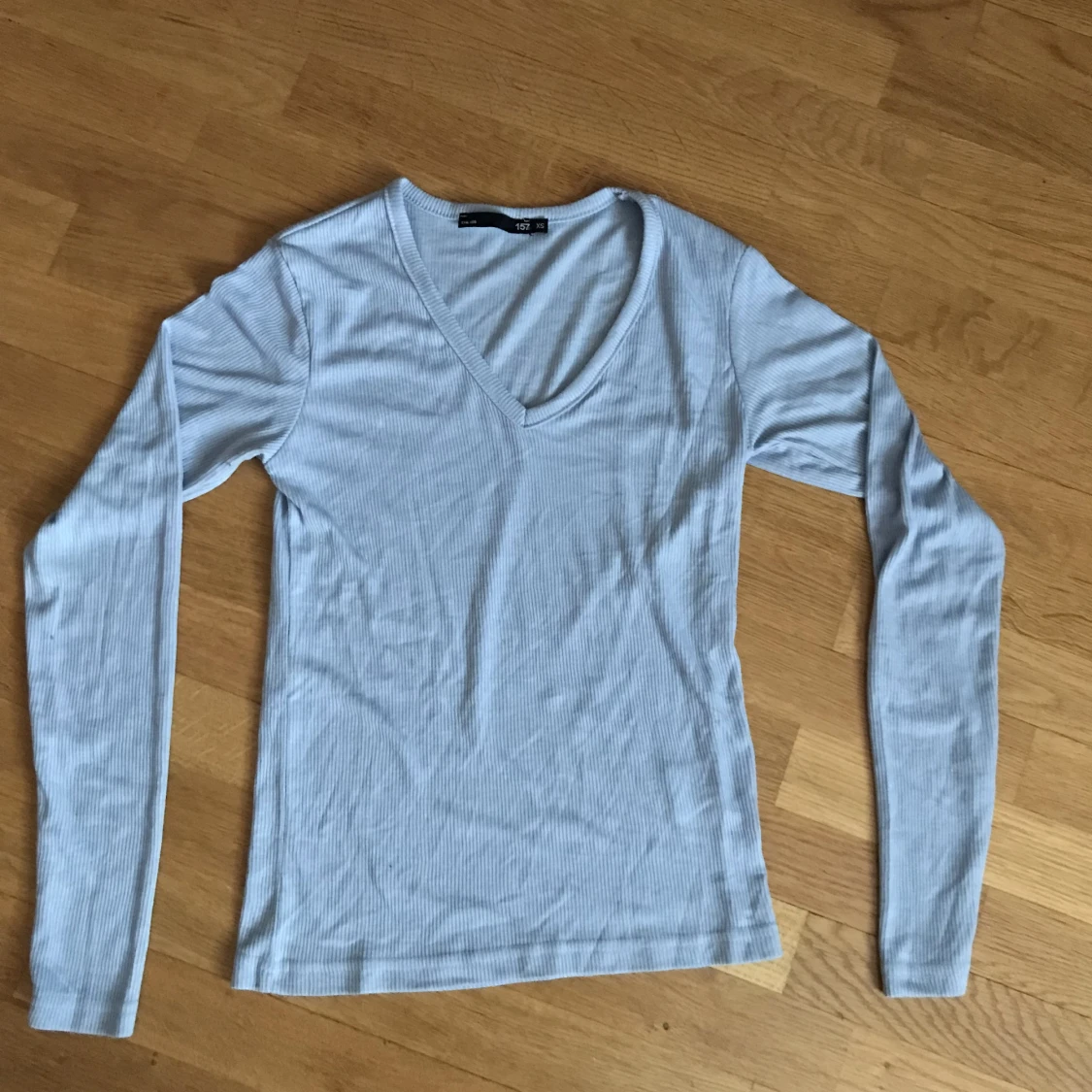 ljus blå långärmad