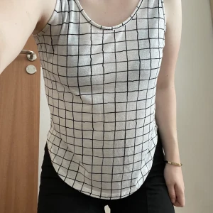 White top - White top with black/blue lines. Has pilling. 