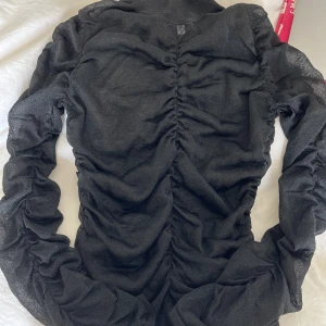 Topp - Glittrig topp från &otherstories