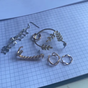 en örhängen  - dessa örhängen kan du bara styla på ett öra. som kan få örat att se lite extra tillfixat ut. ifall du är intresserad meddela vilken du är intresserad in så får du reda på priset. alla kostar 160kr
